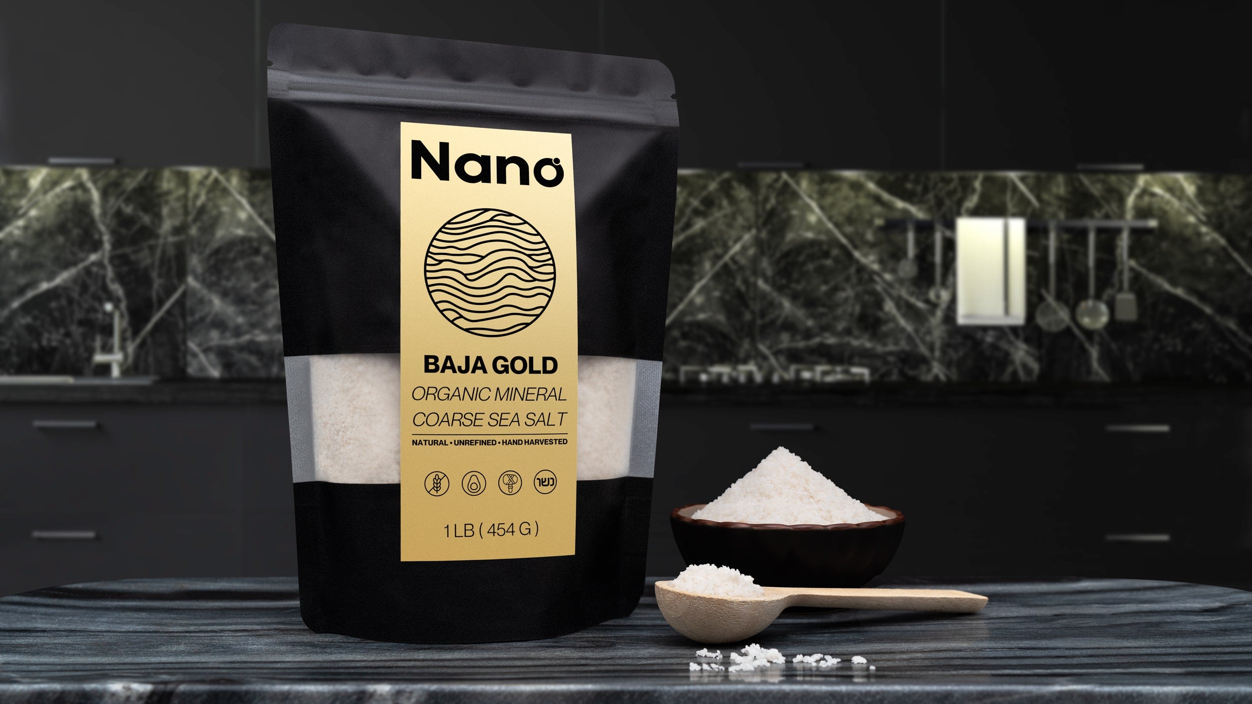 1 LB bag of Nano Baja Gold Sea Salt sitting on a marble countertop in a modern kitchen