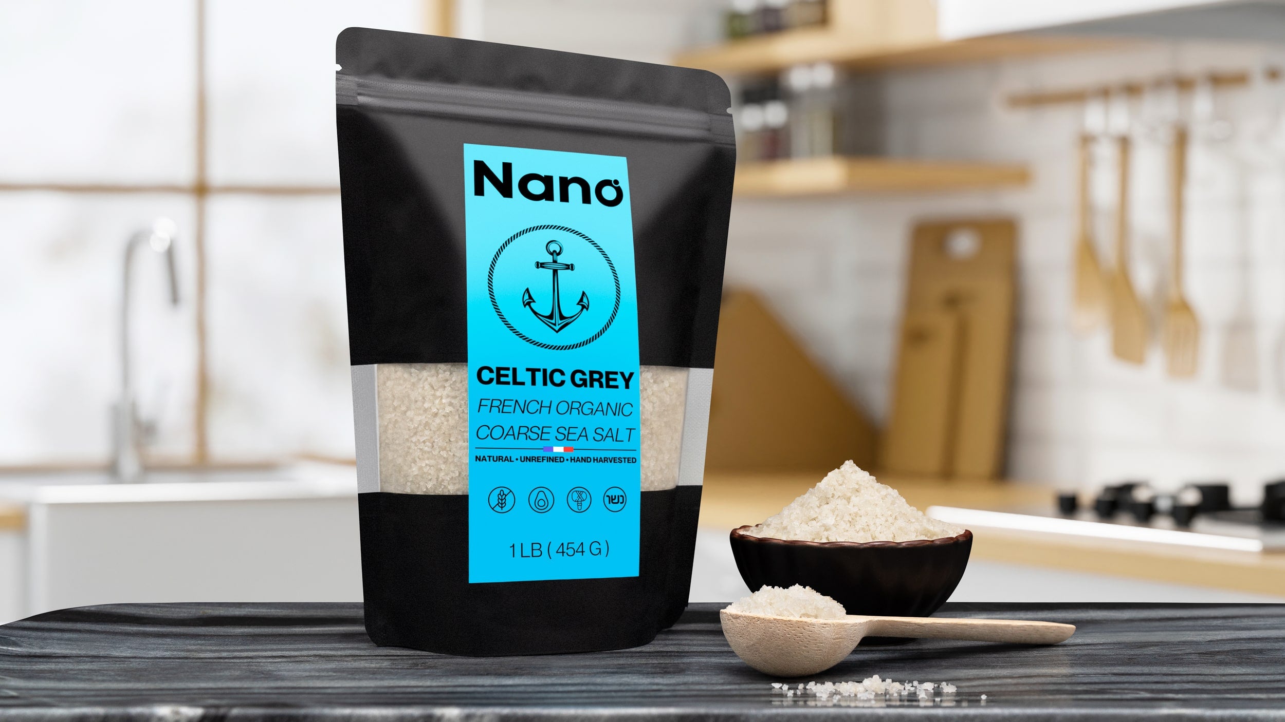 1 LB bag of Nano Celtic Grey French Organic Coarse Sea Salt sitting on a marble countertop in a bright modern kitchen