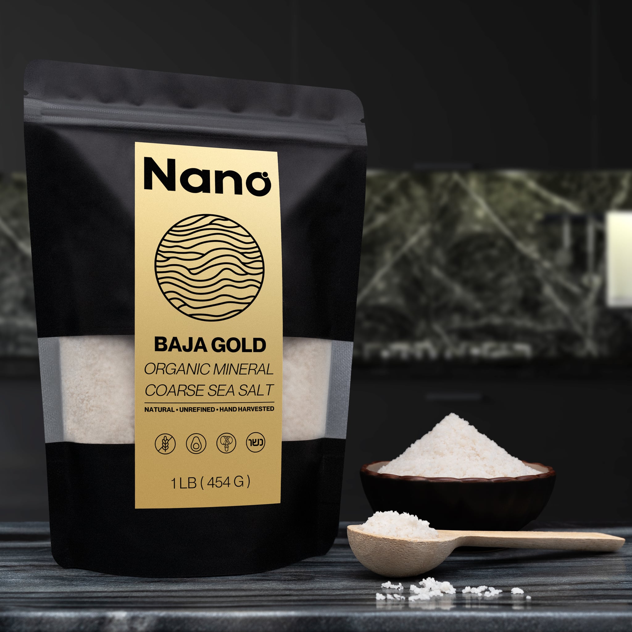 1 LB bag of Nano Baja Gold Sea Salt sitting on a marble countertop in a modern kitchen