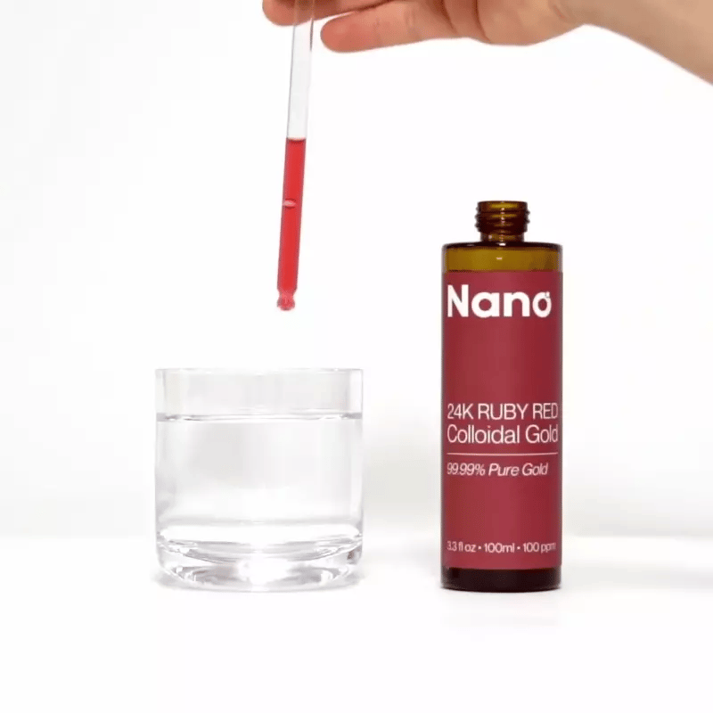 Mixing a few drops of Nano colloidal gold into a glass of water