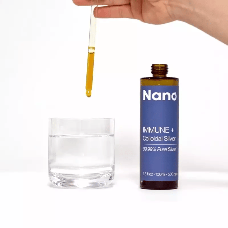 Mixing a few drops of Nano colloidal silver into a glass of water